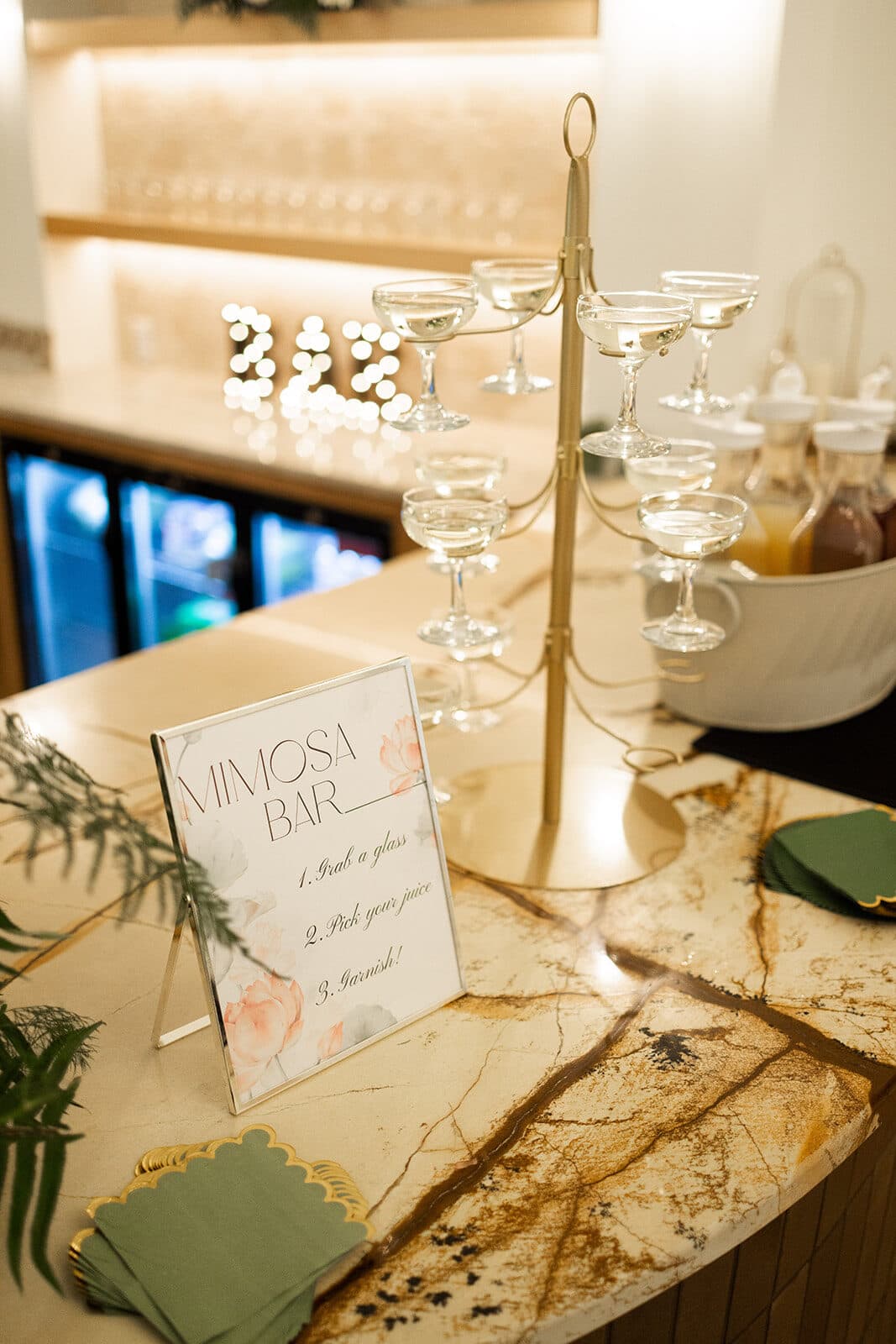 Mimosa bar with a coupe glass tower