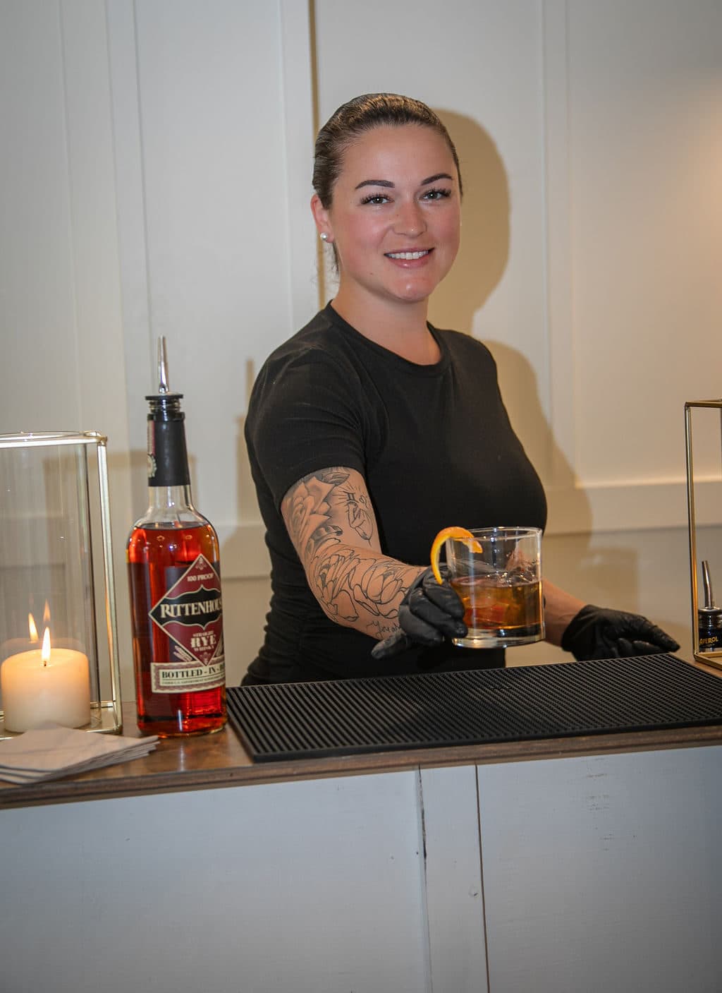 Professional bartender crafting a signature cocktail